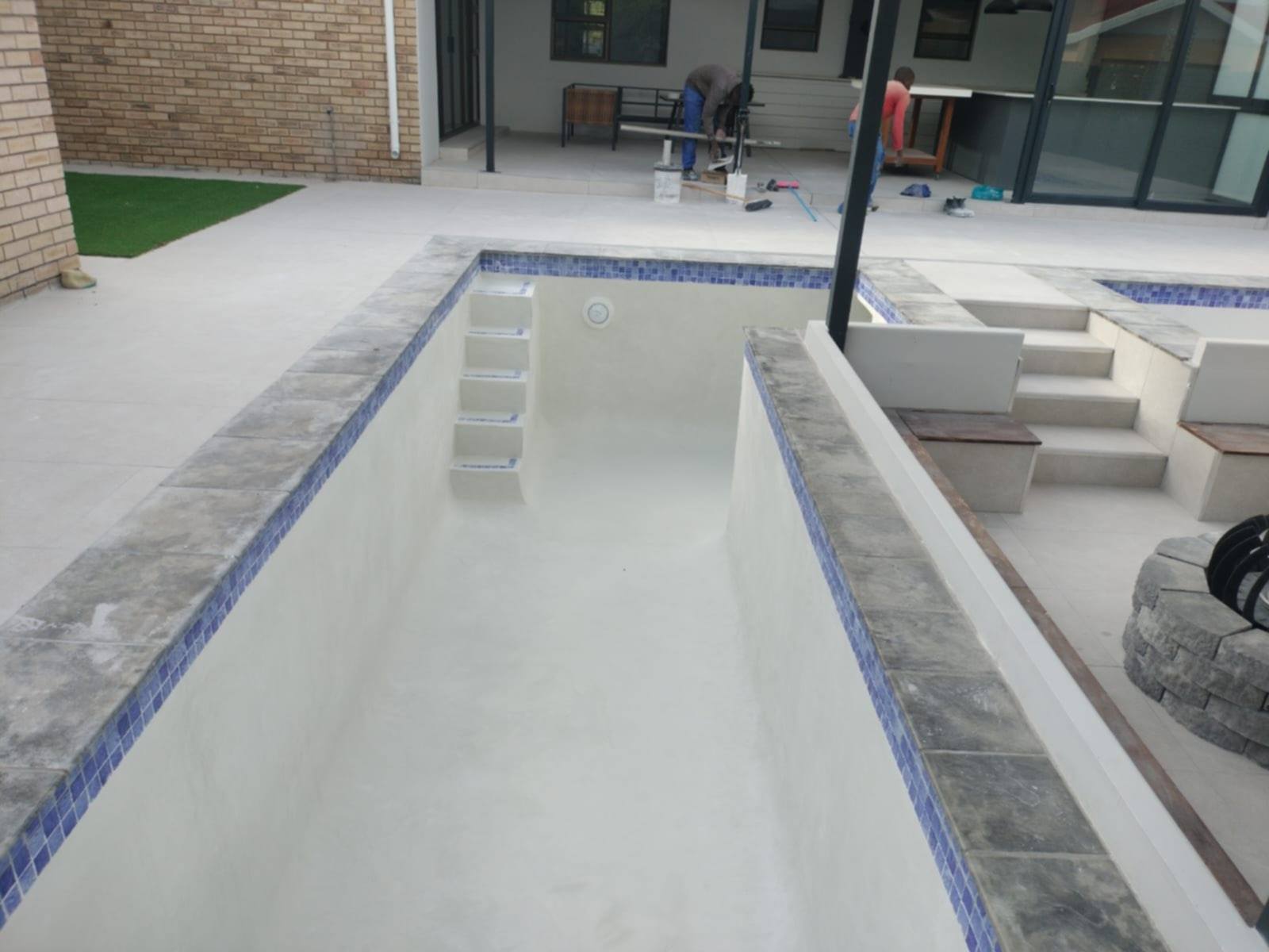 New rectangular concrete swimming pool with mosaic trim under construction in Port Elizabeth, Eastern Cape